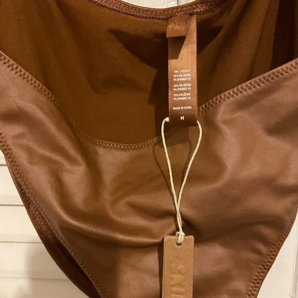 Skims swim cut out one piece suit